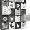 A close-up view of a black and white advent calendar with 24 drawers, some of which are open. Náhled obrázku produktu