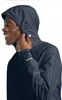 A man wearing a navy blue hooded jacket. Anteprima dell’immagine prodotto