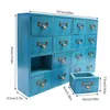 A blue wooden cabinet with multiple drawers and a separate small drawer unit shown next to it, with dimensions indicated by overlaid text. Produktbild-Vorschau