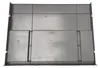 The image shows the underside of a gray plastic tray with a grid-like pattern and some text and symbols embossed on it. Produktbild-Vorschau