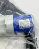 A close-up of a blue and white electrical connector, partially wrapped in plastic. Produktbild-Vorschau