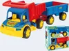 A toy dump truck with a trailer, shown from a slightly elevated front-left angle, with its packaging box to the right. Produktbild-Vorschau