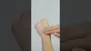 A person is applying cream to their hand. Náhled obrázku produktu