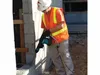 A construction worker is using a demolition hammer on a building site. Anteprima dell’immagine prodotto