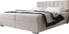 A beige boxspring bed with a mattress, pillows, and a blanket. Voir les images du produit