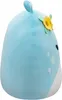 A side view of a blue plush toy alien with a yellow flower and green leaves on its head. Podgląd zdjęcia produktu