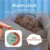 A child sleeping in bed with an alarm clock in the foreground. Náhľad obrázku produktu
