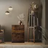 A hallway or entryway scene with a shoe cabinet, coat rack, and decorative items. Náhled obrázku produktu