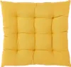 A yellow tufted cushion for a chair. Produktbild-Vorschau