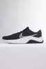 A side view of a black Nike sneaker with a white sole and a white Nike swoosh logo. Náhľad obrázku produktu