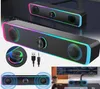 A collage of images showing computer speakers with RGB lighting, cables, and a desktop setup. Produktbild-Vorschau