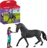 A toy horse and rider set with its packaging. Voir les images du produit