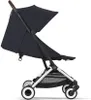 A side view of a black baby stroller against a white background. Anteprima dell’immagine prodotto