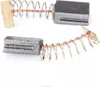 Two carbon brushes with springs, isolated on a white background. Produktbild-Vorschau
