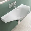 A modern white washbasin mounted on a green wall. Produktbild-Vorschau