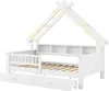 A white house-shaped bed frame with wooden slats and two drawers underneath. It is decorated with string lights. Produktbild-Vorschau