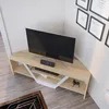 A modern living room corner with a TV stand and television. Voir les images du produit