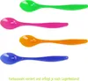 Four colorful plastic spoons are arranged vertically against a white background. Produktbild-Vorschau