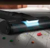 A close-up of a vacuum cleaner head with LED lights illuminating the floor, cleaning up small colorful candies and debris. Anteprima dell’immagine prodotto