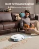 A man is sitting on a couch, petting his dog, while a robot vacuum cleaner cleans the floor in front of them. Náhled obrázku produktu