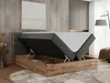 A modern bedroom with a boxspring bed with its storage compartment open. Produktbild-Vorschau