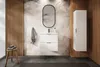 A modern bathroom vanity with a sink, mirror, and storage cabinet, set against a tropical-themed wallpaper and wood-paneled wall. Podgląd zdjęcia produktu