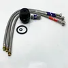 A collection of plumbing parts, including flexible hoses, a black rubber component, and a small metal valve, arranged on a white surface. Produktbild-Vorschau