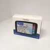 A product box for a TomTom navigation device is shown on a white surface. Voir les images du produit