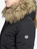Close-up of a woman wearing a black winter jacket with a fur-lined hood. Produktbild-Vorschau