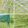 A collage of four close-up images showing details of a metal pet enclosure, including its construction, a spring mechanism, a green cover, and how it is secured to the ground. Podgląd zdjęcia produktu