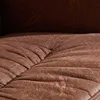 A close-up view of the textured brown leather-like upholstery of a recliner chair and ottoman. Produktbild-Vorschau