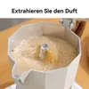 A moka pot is brewing coffee, with foamy coffee flowing into the top chamber. Produktbild-Vorschau