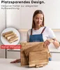 A woman in a kitchen setting is showcasing a set of wooden cutting boards and a holder. Náhled obrázku produktu