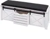 A white storage bench with a black cushion and a pull-out wooden crate. Podgląd zdjęcia produktu
