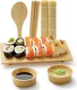 A sushi making set displayed on a wooden board with dipping bowls. Produktbild-Vorschau