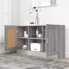 A gray wooden sideboard with open doors, displaying items inside and a mirror reflecting the ceiling in the background. Voir les images du produit