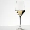 A glass of white wine on a white surface against a white background. Produktbild-Vorschau