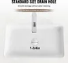 A white ceramic sink with water flowing into the drain, showing the drain hole size. Anteprima dell’immagine prodotto