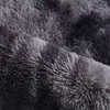 A close-up view of a shaggy rug with an ombre effect, showing the texture and fibers. Náhled obrázku produktu