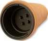 A close-up, angled view of the inside of a terracotta-colored planter with a black plastic insert. Náhľad obrázku produktu