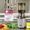 A slow juicer is displayed next to fresh produce, with a Kitchen Innovation Award badge in the foreground. Produktbild-Vorschau
