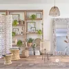 A cozy living room corner with shelves, a mirror, and decorative items. Náhled obrázku produktu