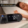 A person sleeping in bed next to a digital alarm clock. Náhľad obrázku produktu