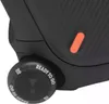 A close-up view of a black JBL Partybox 310 speaker, focusing on a control knob and an orange accent. Produktbild-Vorschau
