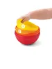 A hand is holding a stack of colorful nesting bowls. Produktbild-Vorschau