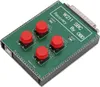 A close-up, angled view of a green circuit board with four red buttons and various text labels. Voir les images du produit