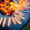Sausages are being grilled on a fire plate. Voir les images du produit