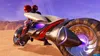 Two figures in futuristic suits ride a futuristic motorcycle across a desert landscape. Produktbild-Vorschau