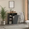 A bathroom scene featuring a laundry cabinet with a hamper, towels on a rack, and a plant. Produktbild-Vorschau