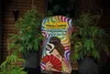 A bag of Floragard Professional Growmix is displayed in front of two potted plants, with a wooden background. Produktbild-Vorschau